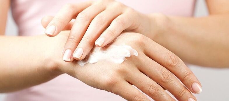 applying cream to the skin of the hands